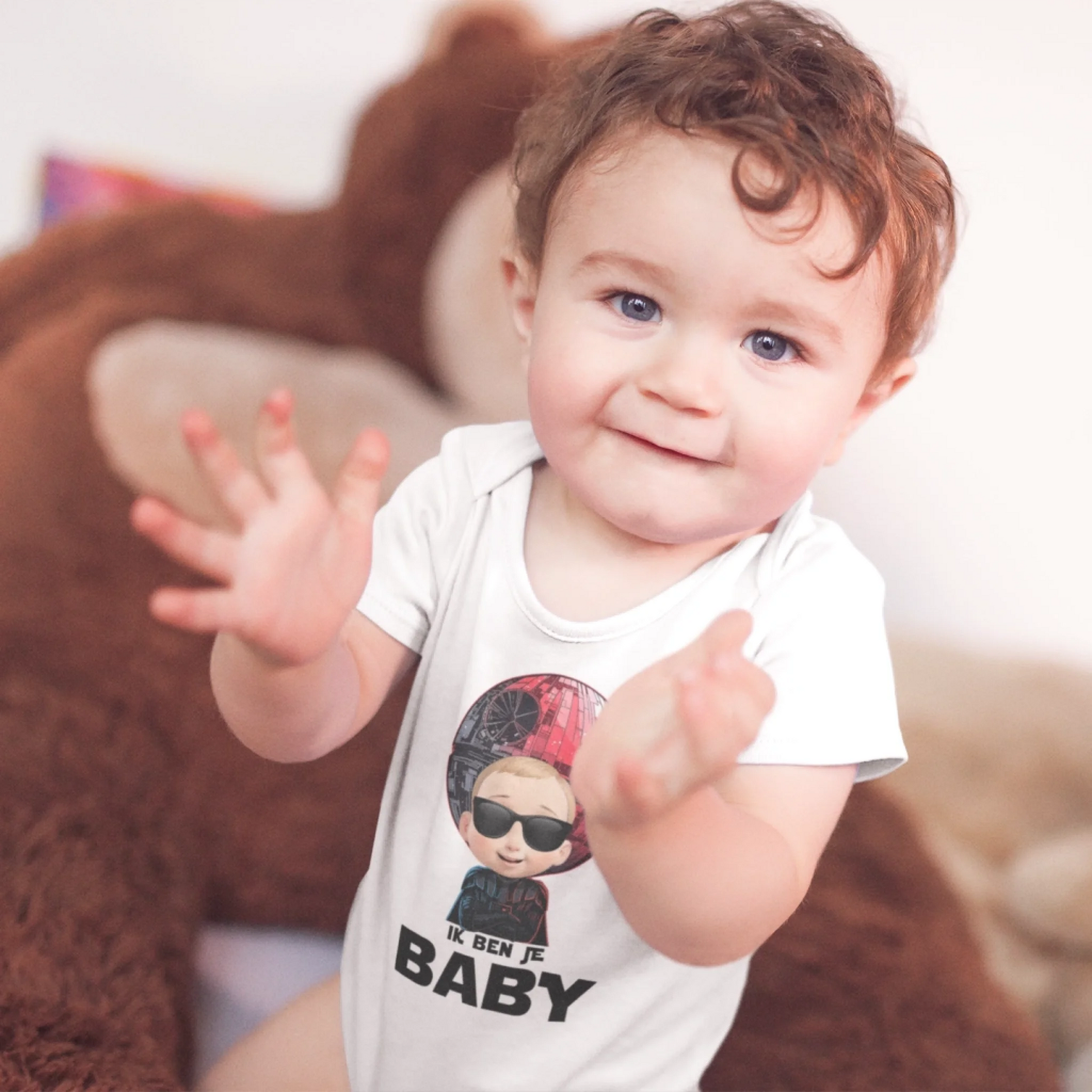 baby-boy-clapping-sitting-down-wearing-a-onesie-with-a-monkey-plush-in-the-background-mockup-a14022-crop
